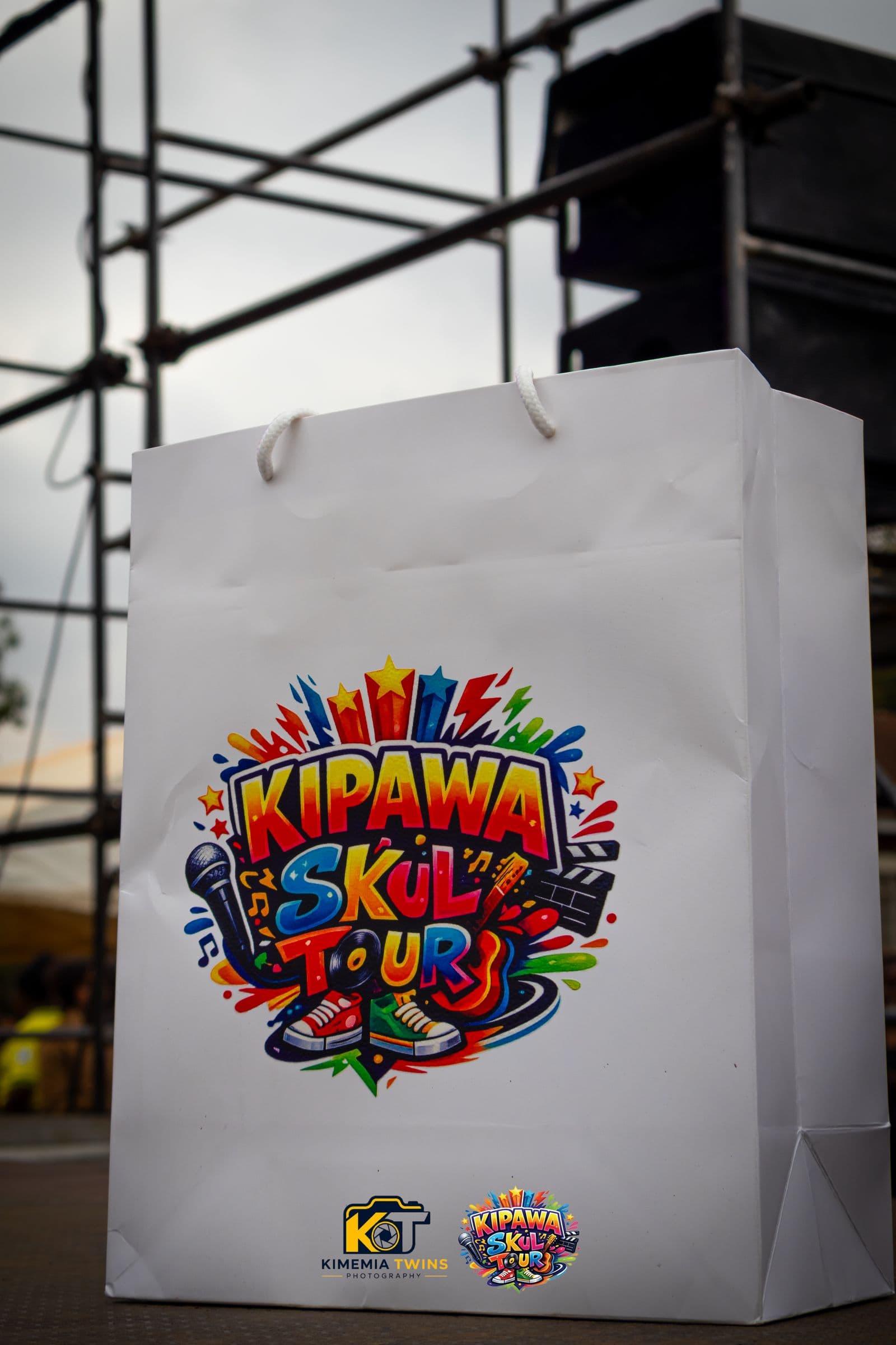 Kipawa Skul Tour branded gift bag at the event stage
