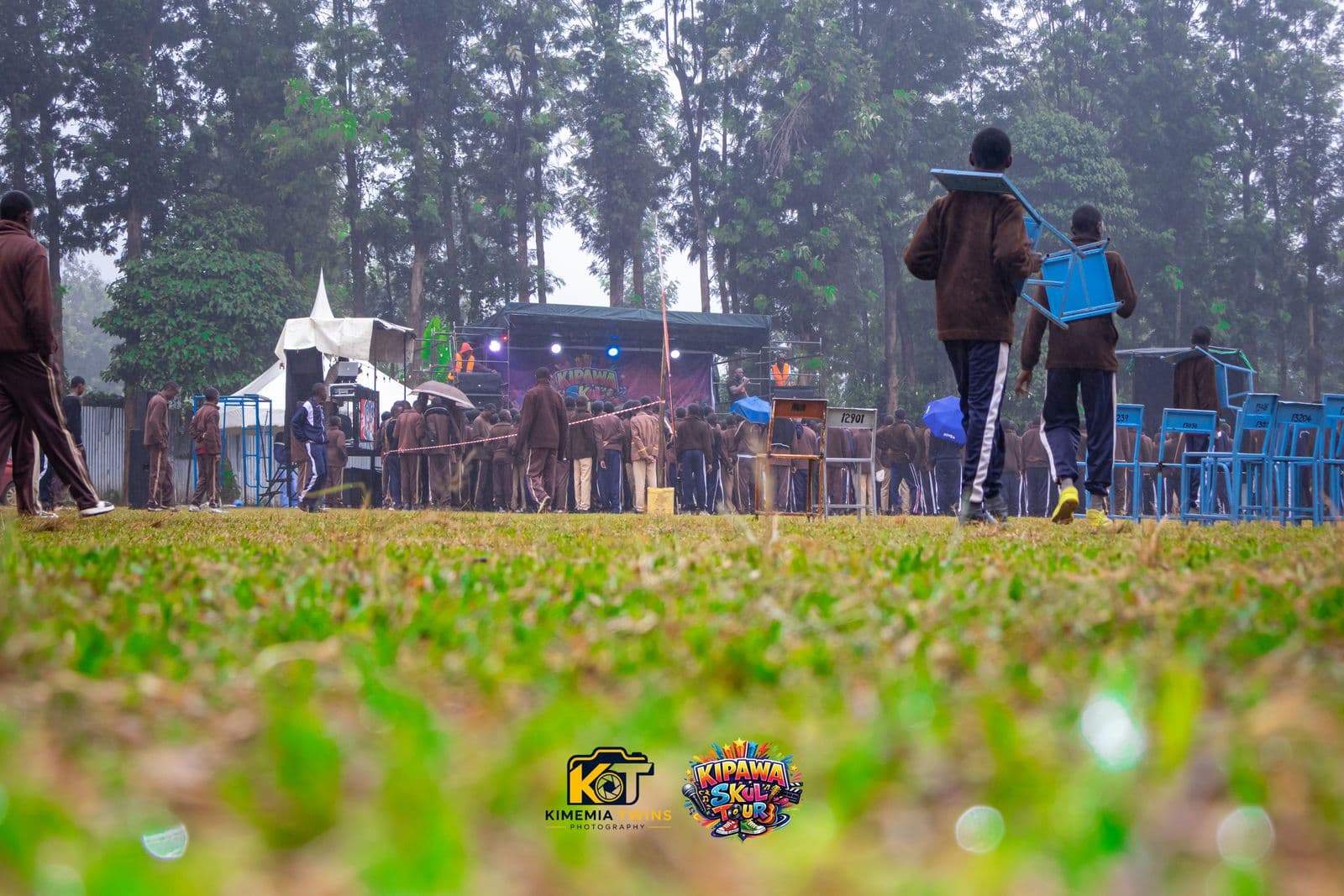 Wide view of the Kipawa Skul Tour venue with event tents and crowds of students