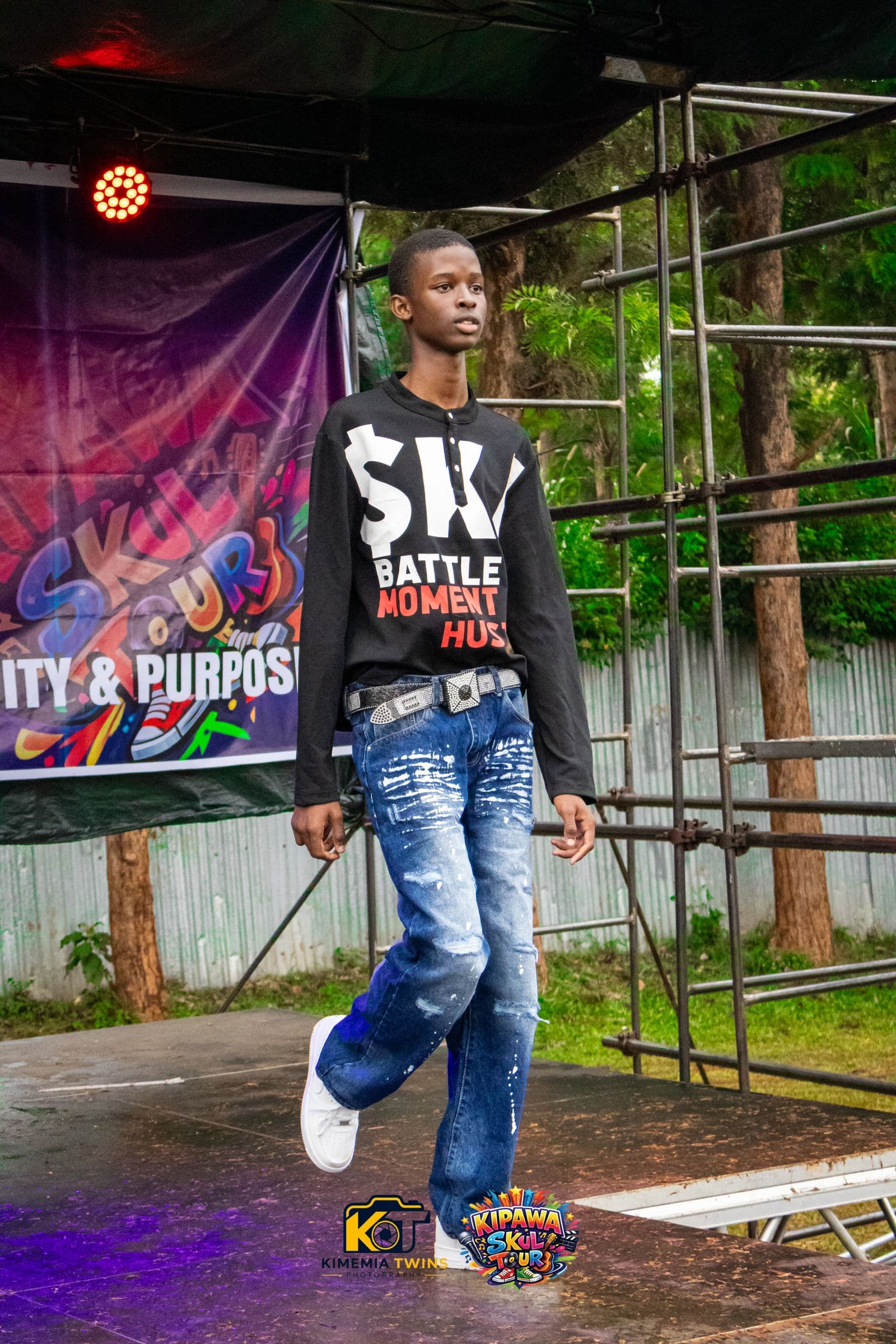 Student performing on the Kipawa Skul Tour stage under stage lighting