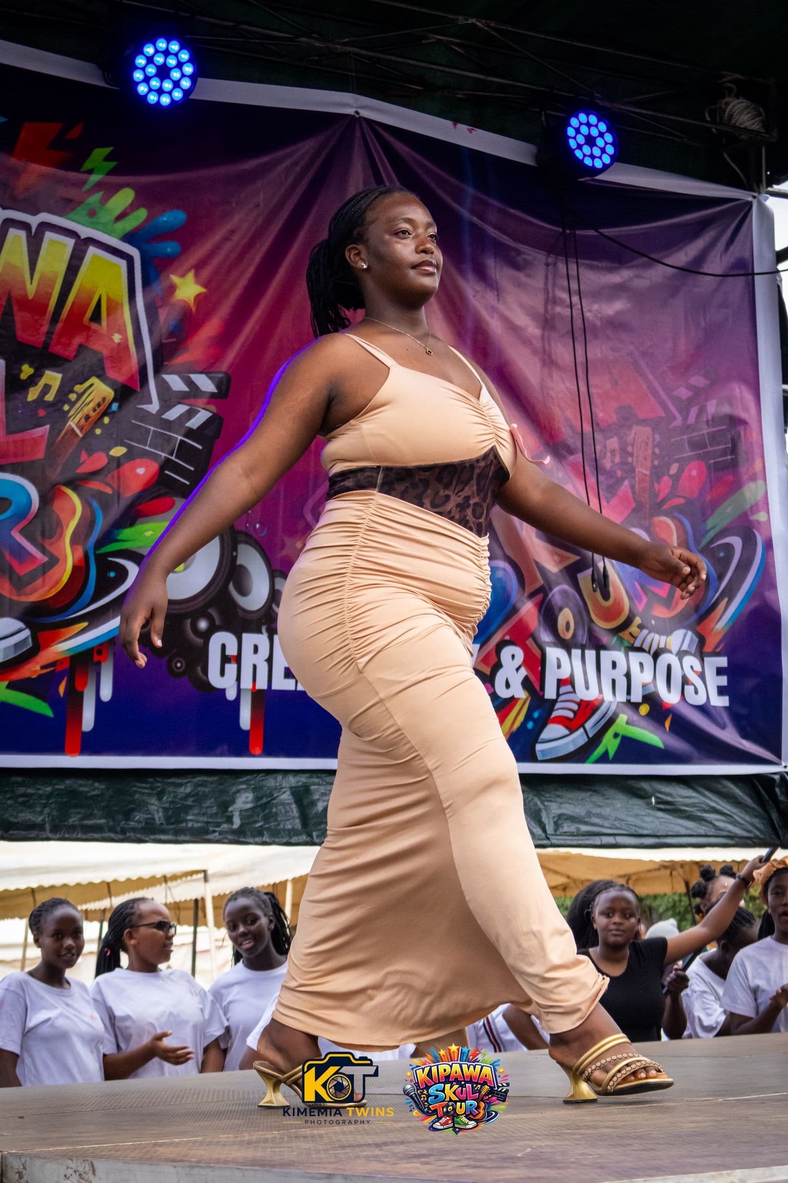Student performer mid-routine on the Kipawa Skul Tour stage under stage lights