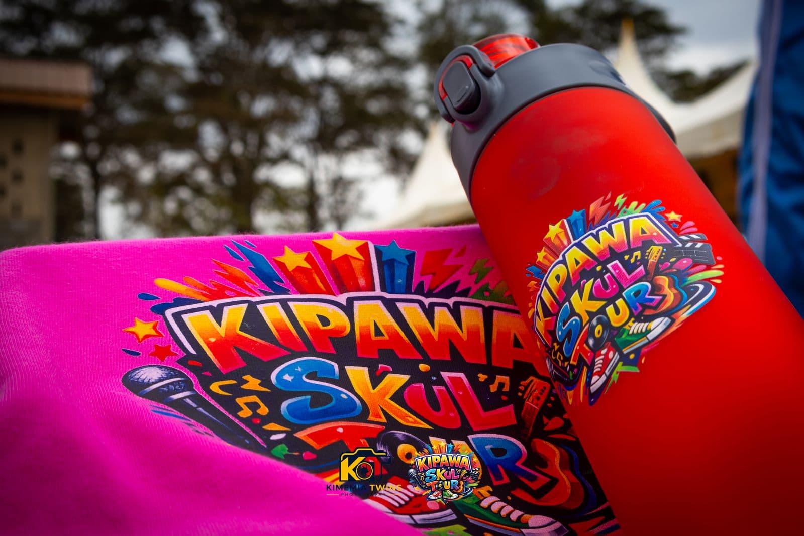 Kipawa Skul Tour branded water bottle and event banner