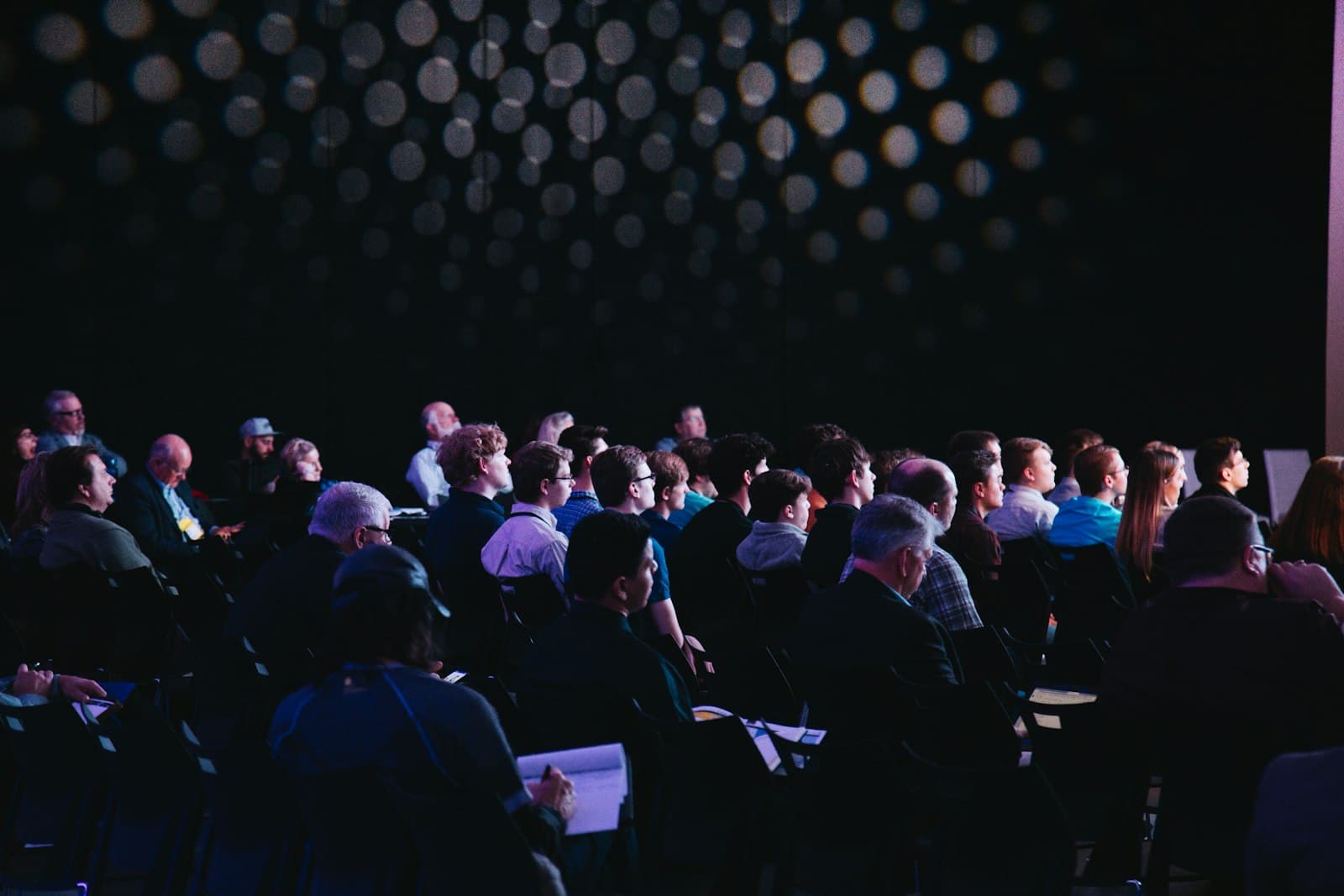 Audience at a professionally lit corporate conference
